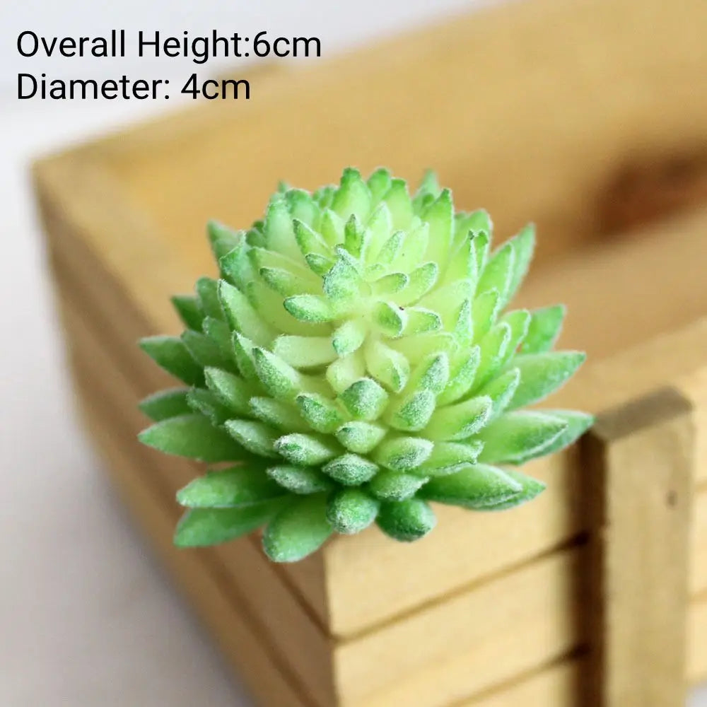 A small, vibrant green fake succulent plant with a rosette shape displayed in a wooden container.