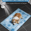 A brown and white dog is lying on a blue pet ice mat in a modern room.