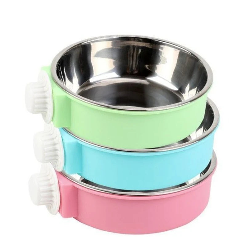 A stack of three stainless steel hanging dog bowls in green, light blue, and pink.