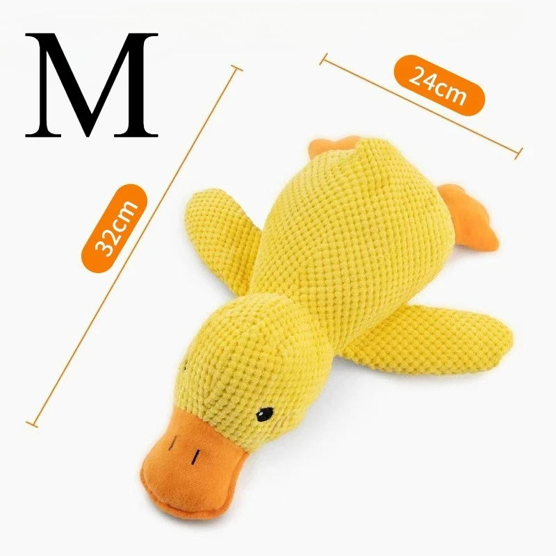 A yellow plush duck dog chew toy with orange accents, shown against a white background.