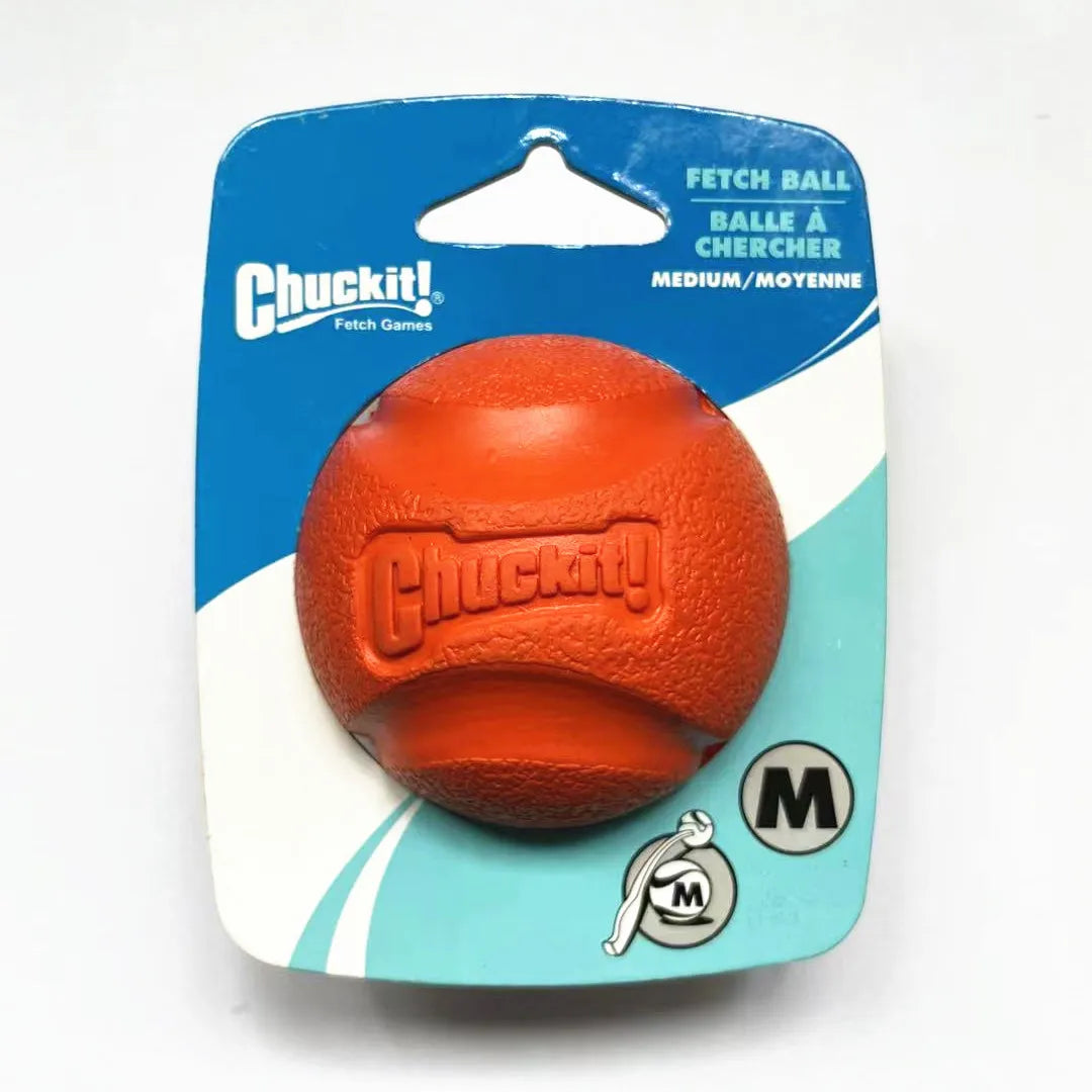 Orange rubber fetch ball packaged in a blue and white cardboard sleeve with the Chuckit brand logo