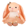 A soft peach-colored plush rabbit toy with large ears and a pink nose.