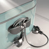 A heavy-duty silicone cable organizer with a silver clip and coiled wires is shown against a light blue background.
