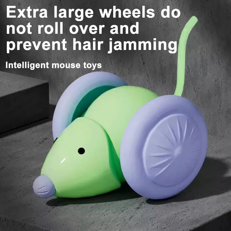 A lime green and purple interactive electric mouse toy with large wheels resting on a gray surface.