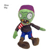 A plush toy of the Plants vs. Zombies Gargantuar with green skin, purple hair, and a red and white striped scarf.