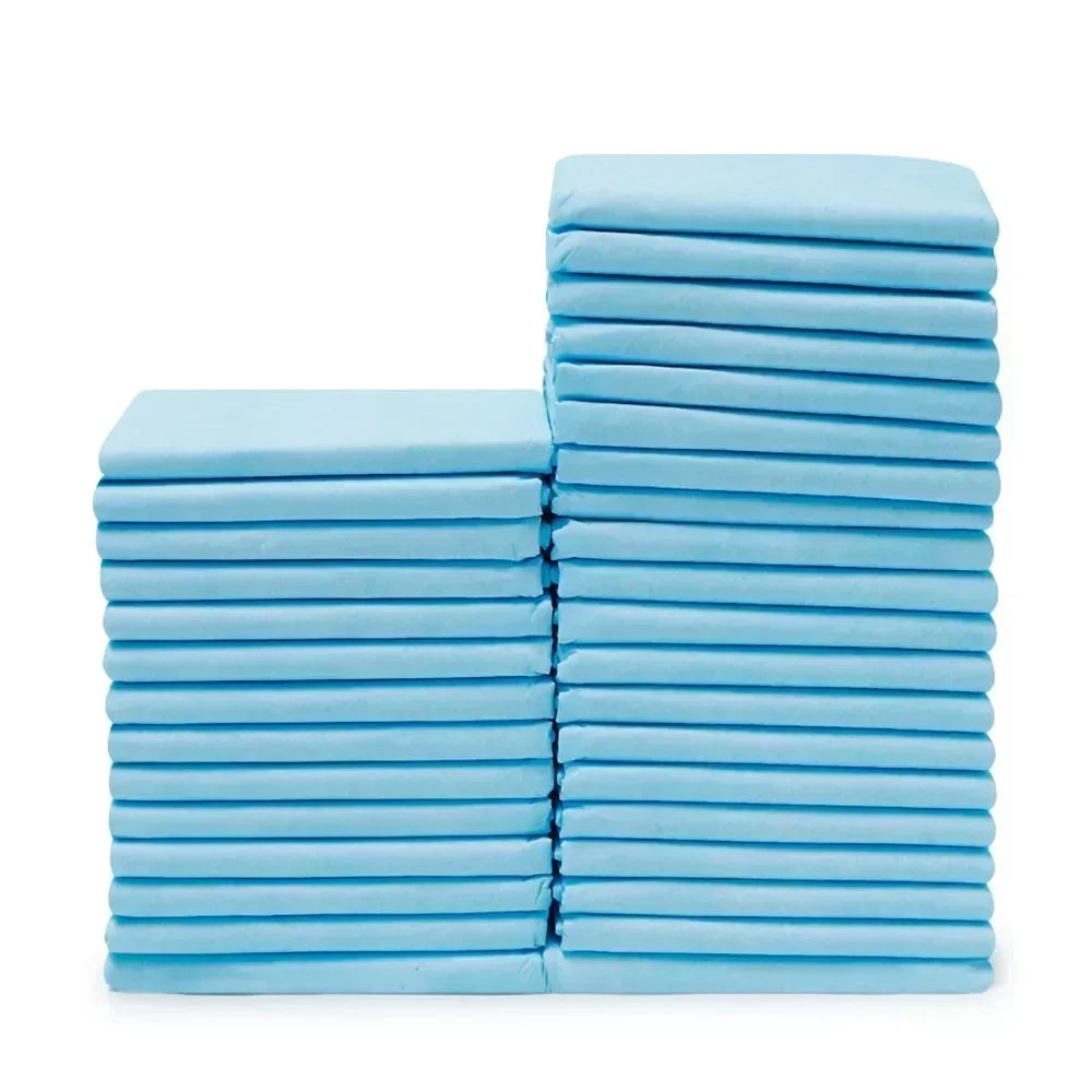 A stack of light blue ultra-absorbent pet training pads.