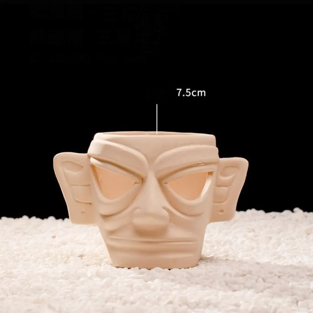 A light beige ceramic aquarium shrimp hideaway cave with a slit opening, measuring 7.5cm.