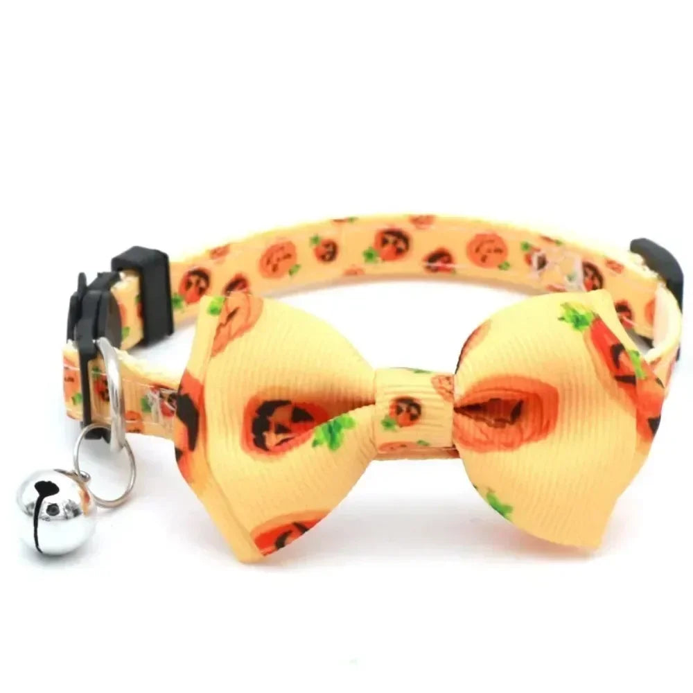 Orange Halloween cat collar with a bow tie and bell featuring a breakaway safety buckle
