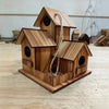 A rustic wooden bird house made of light brown wood with a pitched roof and a natural twine hanging from the entrance.