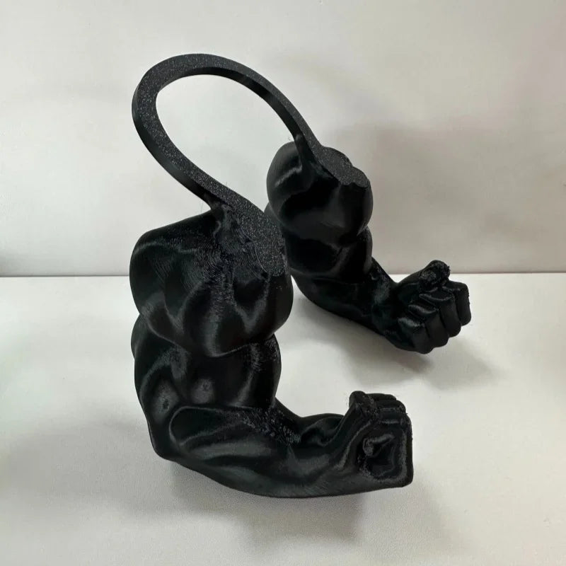 A black 3D printed cat muscle arm accessory showing a curled fist and elongated limb.