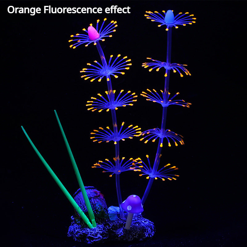 Planta con efecto de fluorescencia naranja, presentando estructuras florales moradas y azules sobre fondo oscuro.