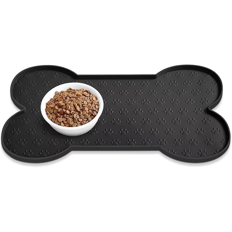 Black anti-slip silicone pet feeding mat with a raised edge holding dry pet food