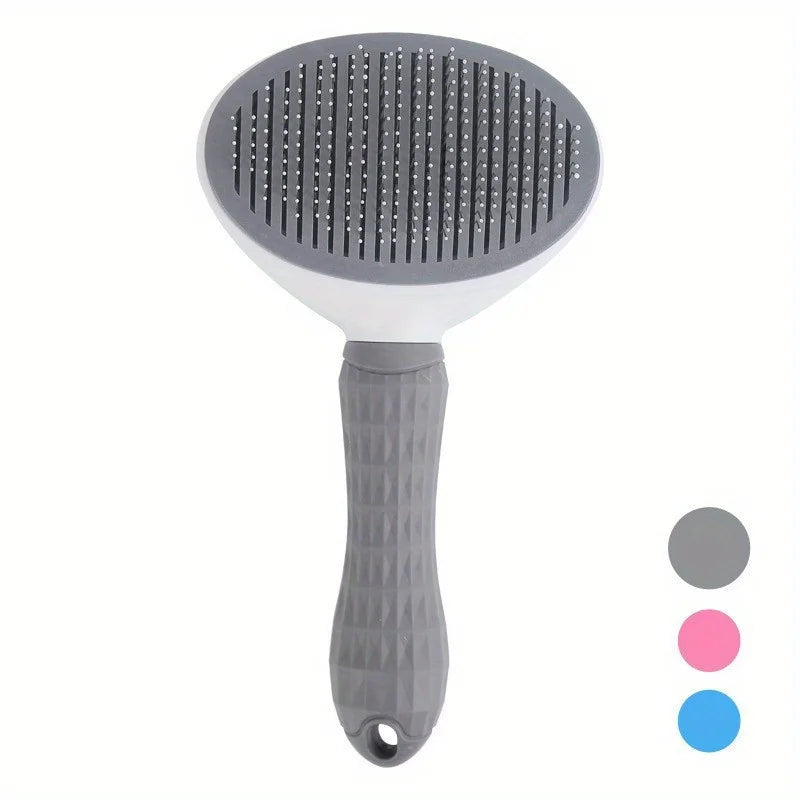 A gray pet hair removal slicker brush with a white handle and pink and blue silicone tips.
