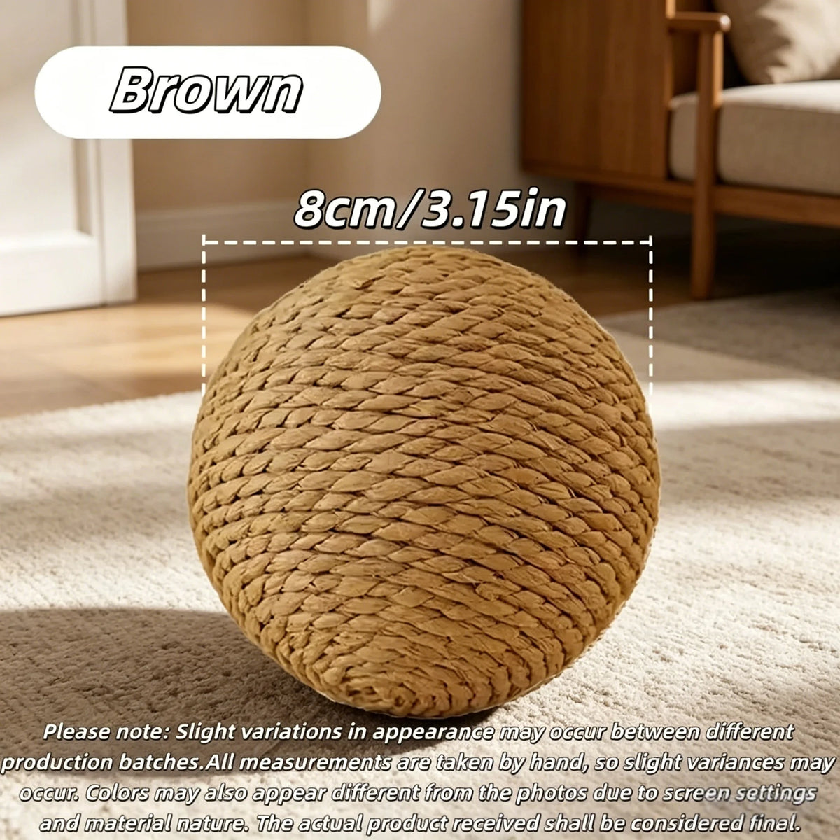 A brown natural sisal cat scratching ball resting on a light-colored rug.