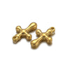 A pair of vintage gold-toned cross charms used for DIY jewelry making.