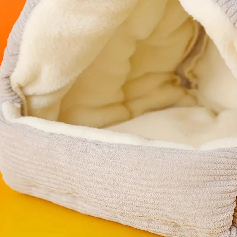 A cozy cotton bird nest lined with soft white fluff, resting on a yellow surface.