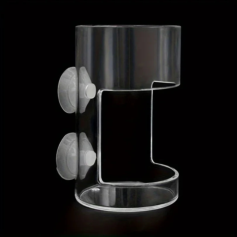 A clear plastic ring with two attached silicone or rubber components for an aquarium fish feeder.