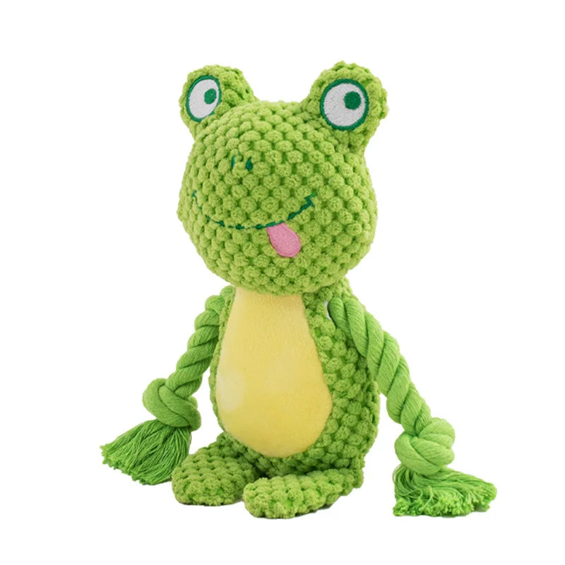 A green plush frog toy with large eyes and a pink tongue, made from green rope.