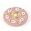 A pink interactive puzzle maze slow feeder bowl with various sized silicone puzzle pieces for pets.