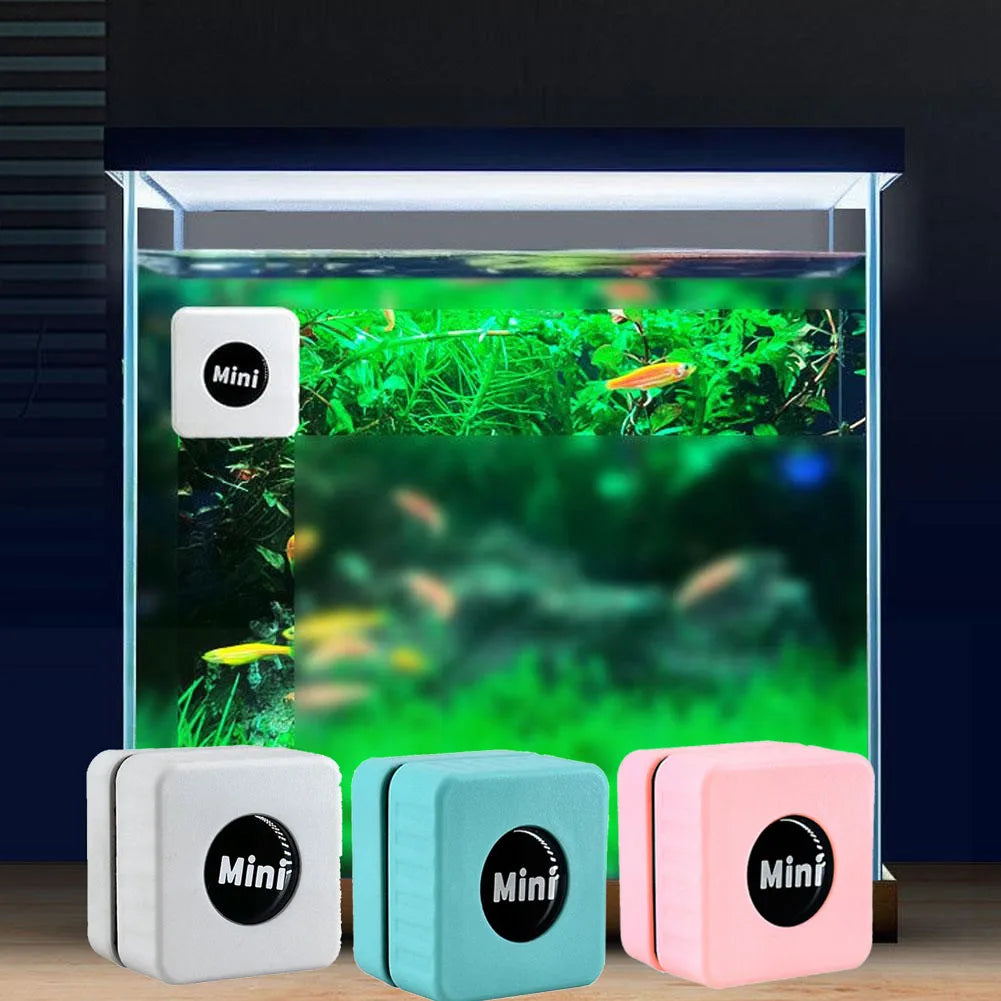 A magnetic aquarium glass cleaner featuring four small, square cleaning blocks in white, teal, and pink colors.