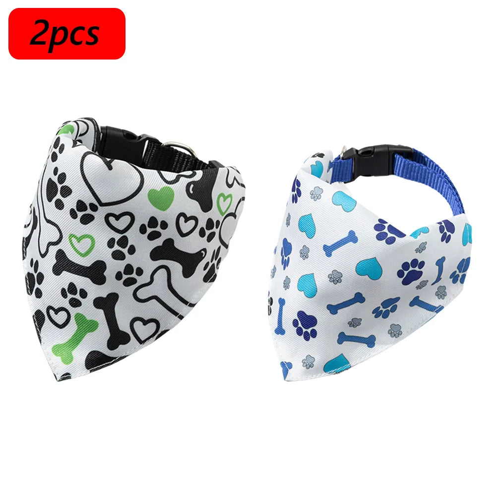 A pair of printed pet collars with matching bandanas featuring paw prints, hearts, and bones for small dogs and cats.