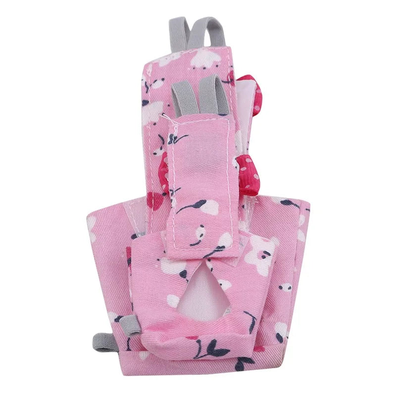 Pink adjustable bird diaper and flight suit with gray straps and floral patterns