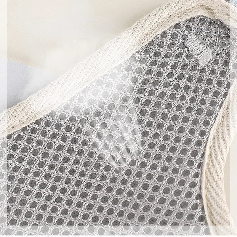 Close-up view of a beige mesh nylon dog harness and leash set for small pets