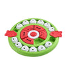Jouet distributeur de puzzles vert pour chiens et chats avec des pièces colorées et blanches.