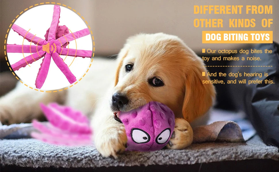 A golden retriever puppy is lying down with a pink squeaky octopus dog biting toy in its mouth.