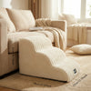 A beige pet safety ladder for dogs and cats used as a sturdy step aid for beds and sofas.