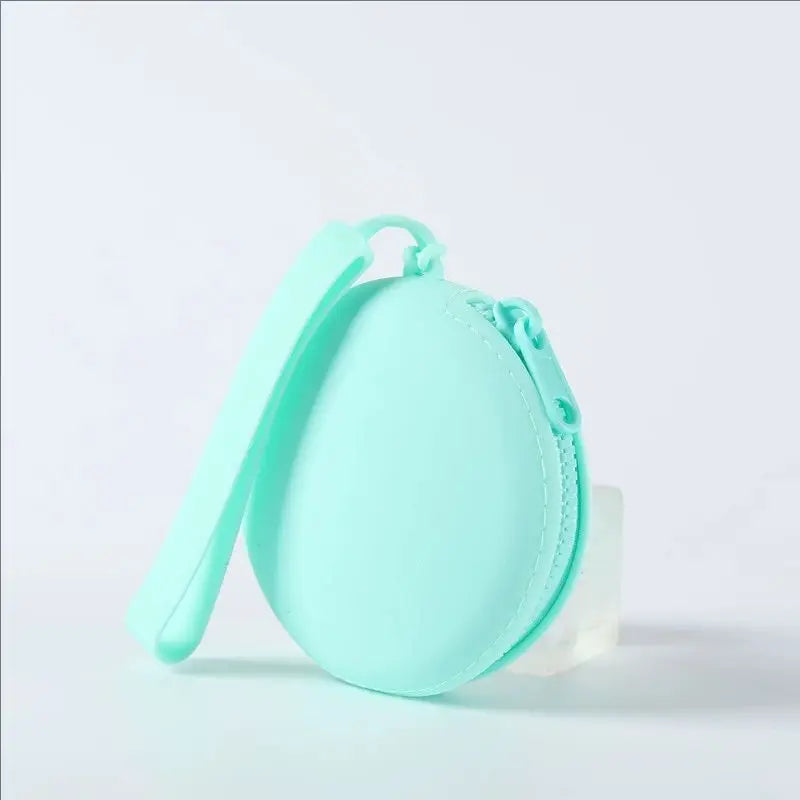 A light mint green silicone pet treat pouch with a zipper closure is shown against a white background.