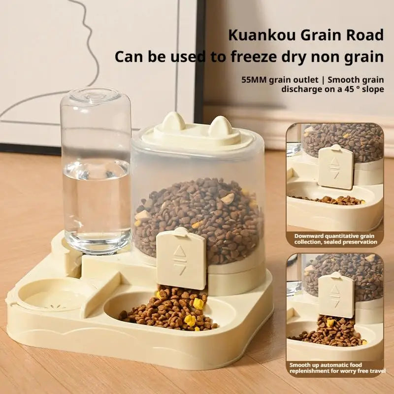 A clear gravity-fed food dispenser with a water bowl for pets, showing dry grain food inside.