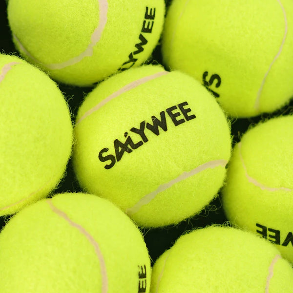 A close-up view of three bright yellow tennis balls with pink stitching.