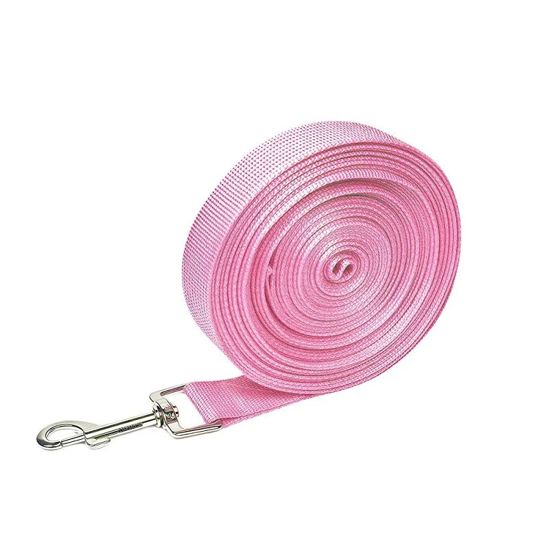 Pink extended nylon dog leash rolled up for training and outdoor walks