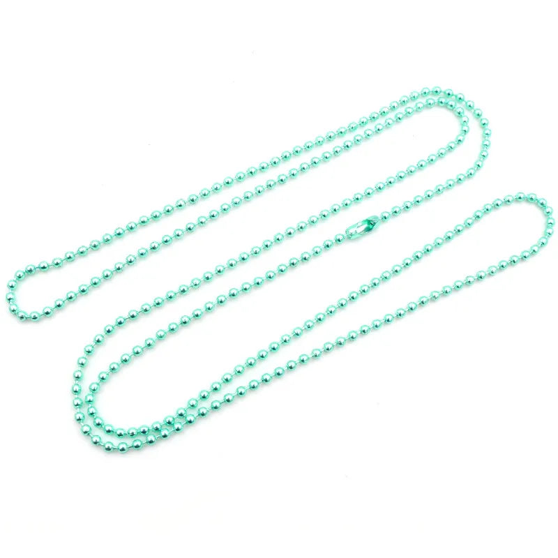 A set of ball necklaces with a delicate chain, featuring gold and silver plating.