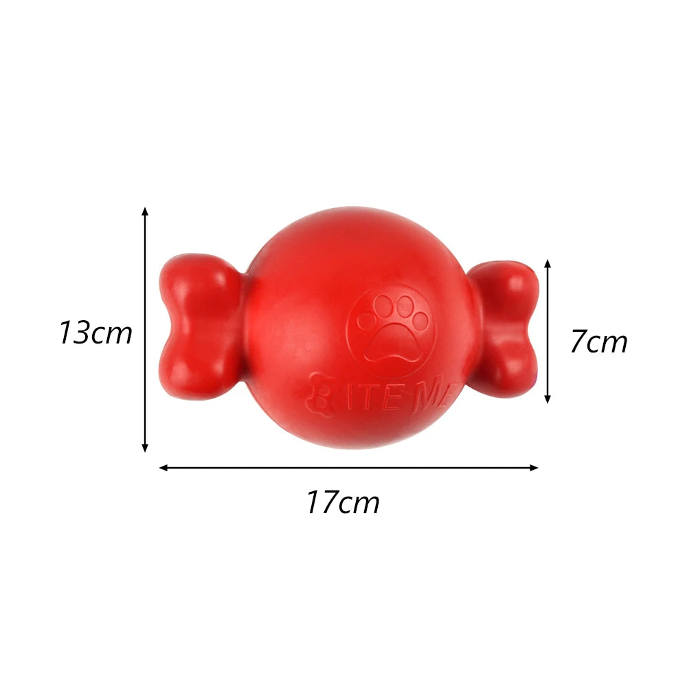 A bright red, spherical dog chew toy with paw prints molded into the surface.