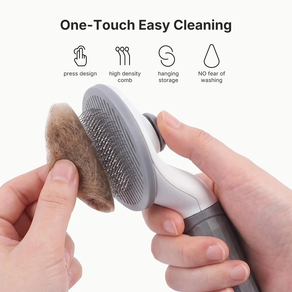 A hand holds a white pet hair brush with a silicone attachment, demonstrating one-touch easy cleaning features.