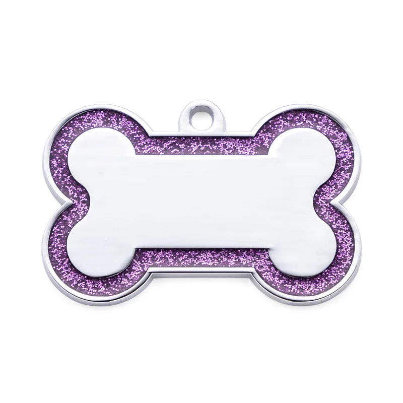 Silver pet ID tag with a bone shape, featuring purple glitter on the border and a white center.