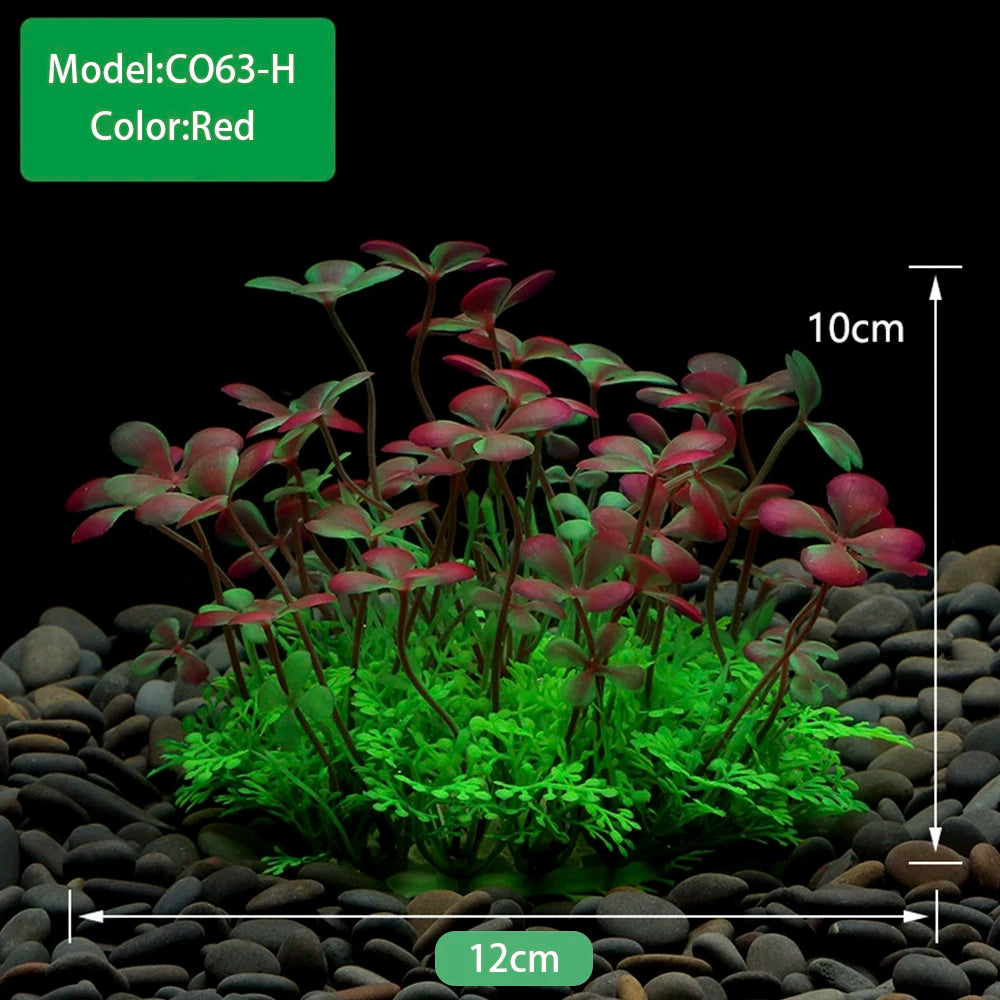 Gros plan de plantes aquatiques artificielles rouges dans un petit paysage.