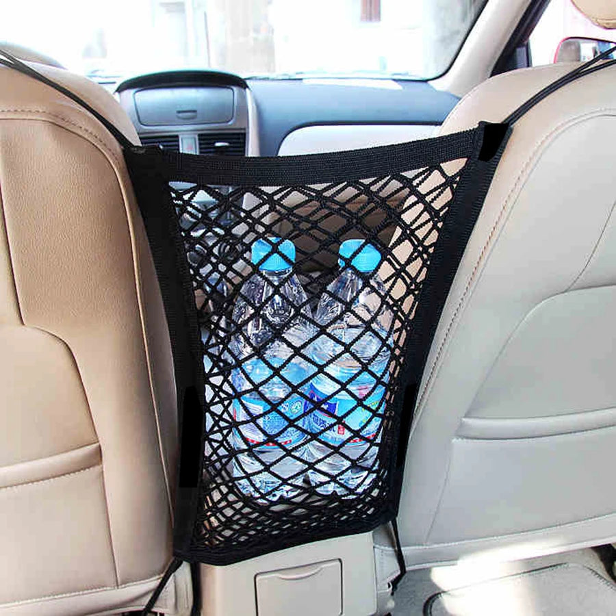 Black mesh storage bag for pets placed between car seats.