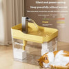 A clear acrylic automatic cat water fountain with a yellow base and a stainless steel pump is shown on a wooden floor.