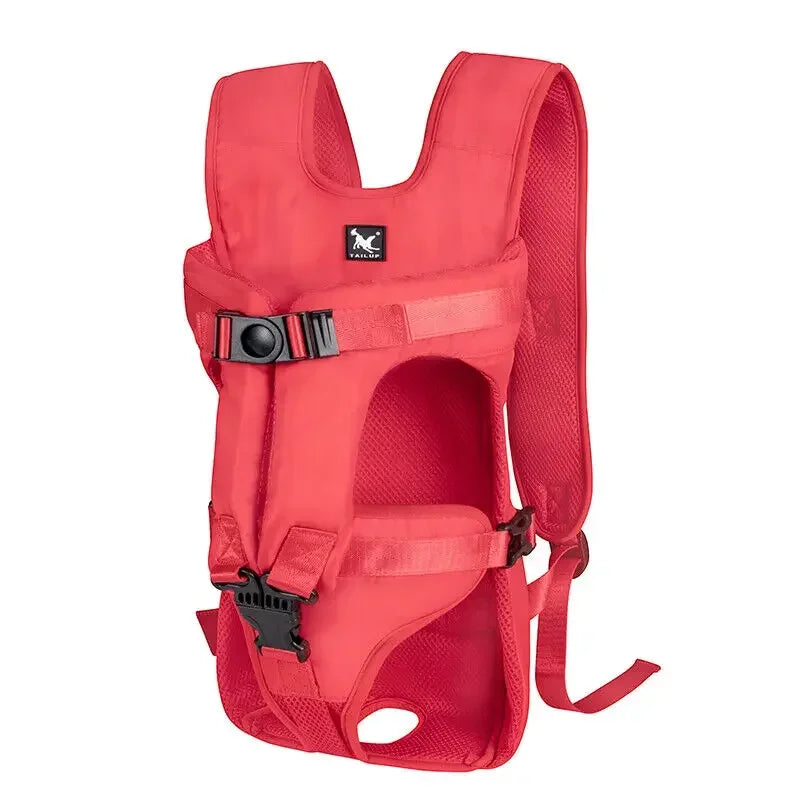 A bright red ventilated pet carrier backpack with black buckles and a logo on the front.