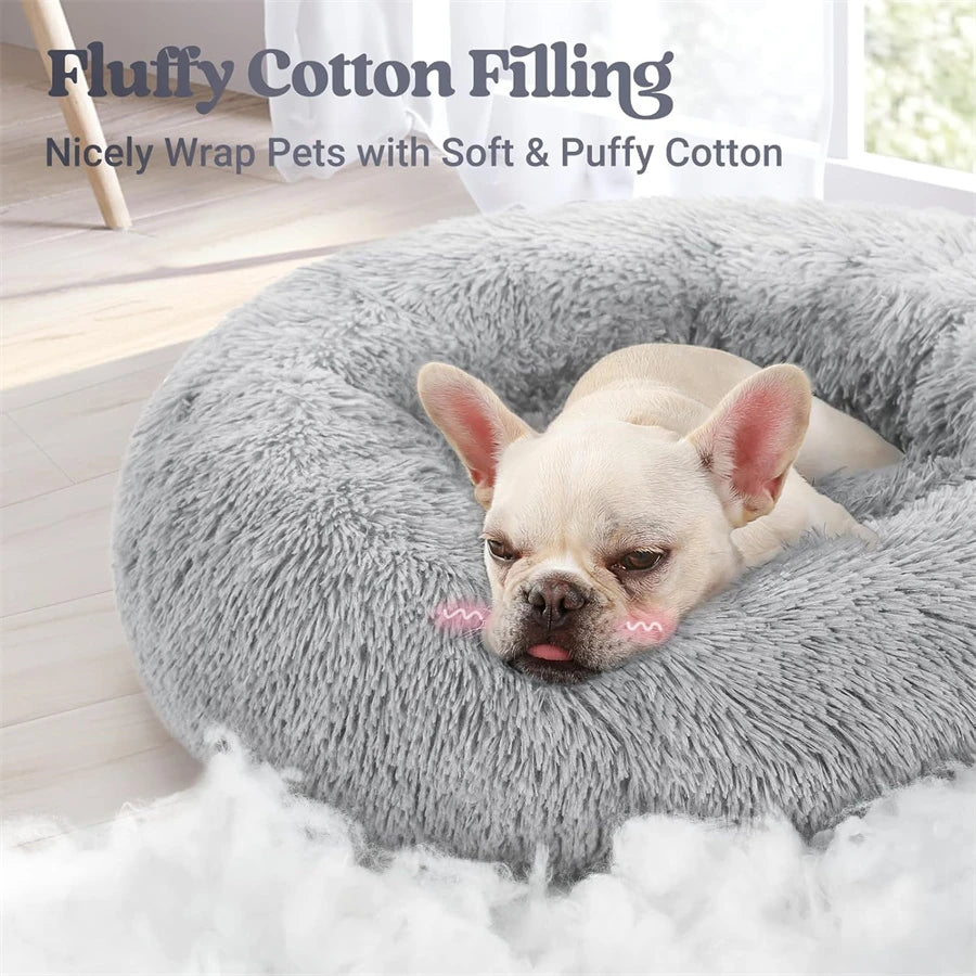 A light gray fluffy cotton filling pet bed with a dog resting on it.