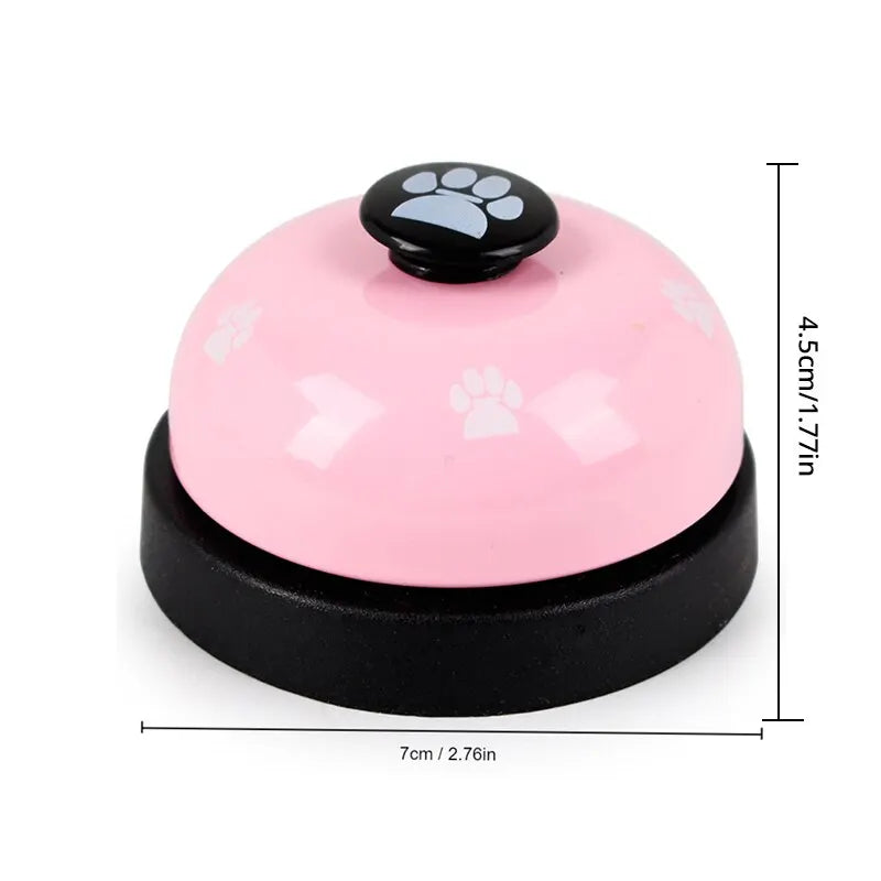 Pink and black pet training bell with a paw print design, measuring 4.5cm high and 7cm wide.
