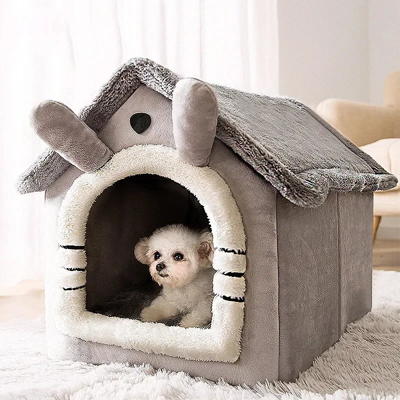 A gray foldable pet kennel with a roof and entrance, featuring a small puppy looking out.