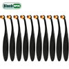 A set of ten black pet tear stain remover brushes for dogs and cats with orange handles.