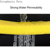 Close-up of a yellow, porous sponge filter demonstrating strong water permeability with water flowing through it.
