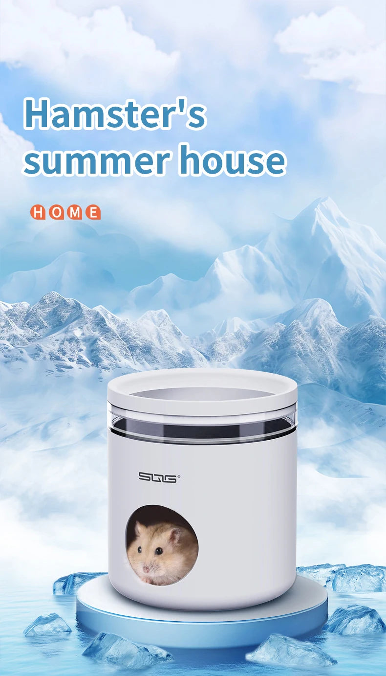 A white cooling hideout for a hamster is shown on a blue surface with icy rocks in the background.