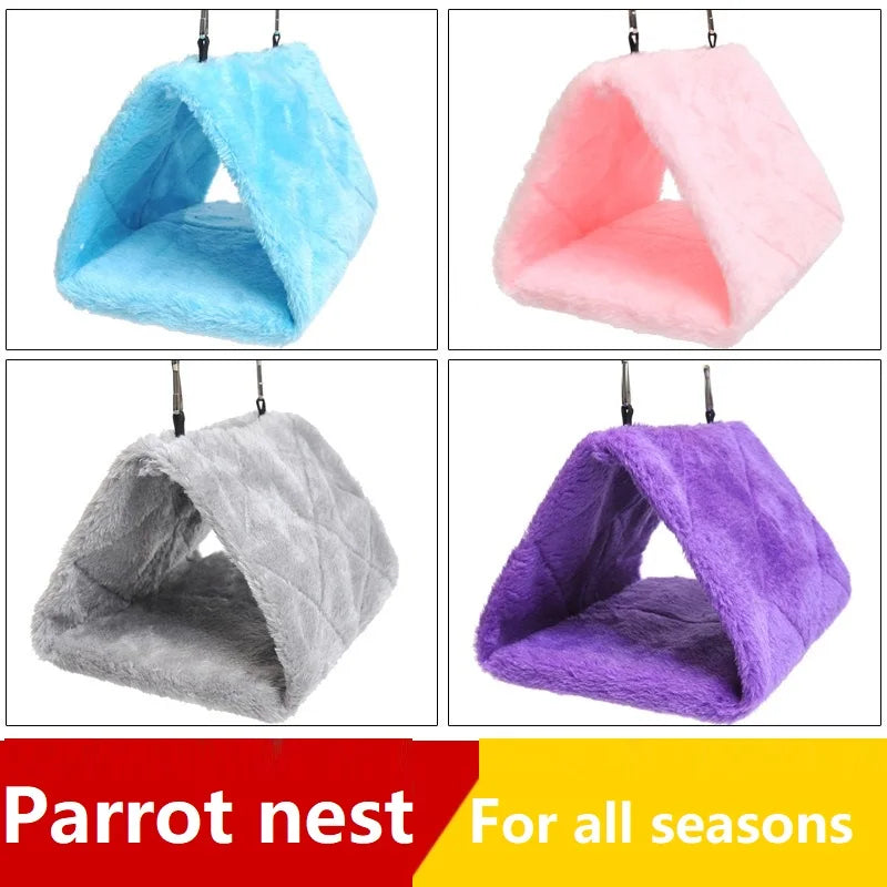 Four colorful plush bird nests in blue, pink, gray, and purple hanging from hooks for parrots
