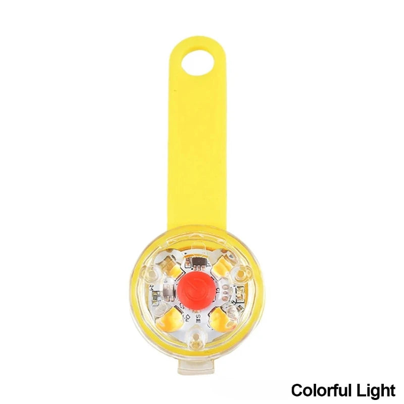 Yellow LED dog collar light with a loop and a clear housing for illumination